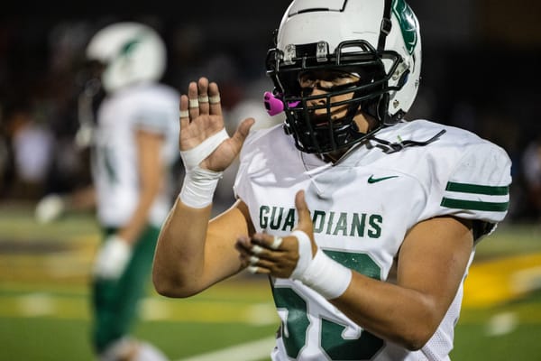 Thursday Night Lights: Wells and Roosevelt football fend off upset bids